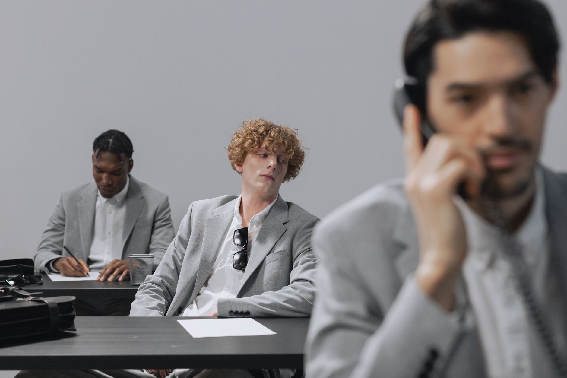Business executives in a formal meeting reviewing financial documents