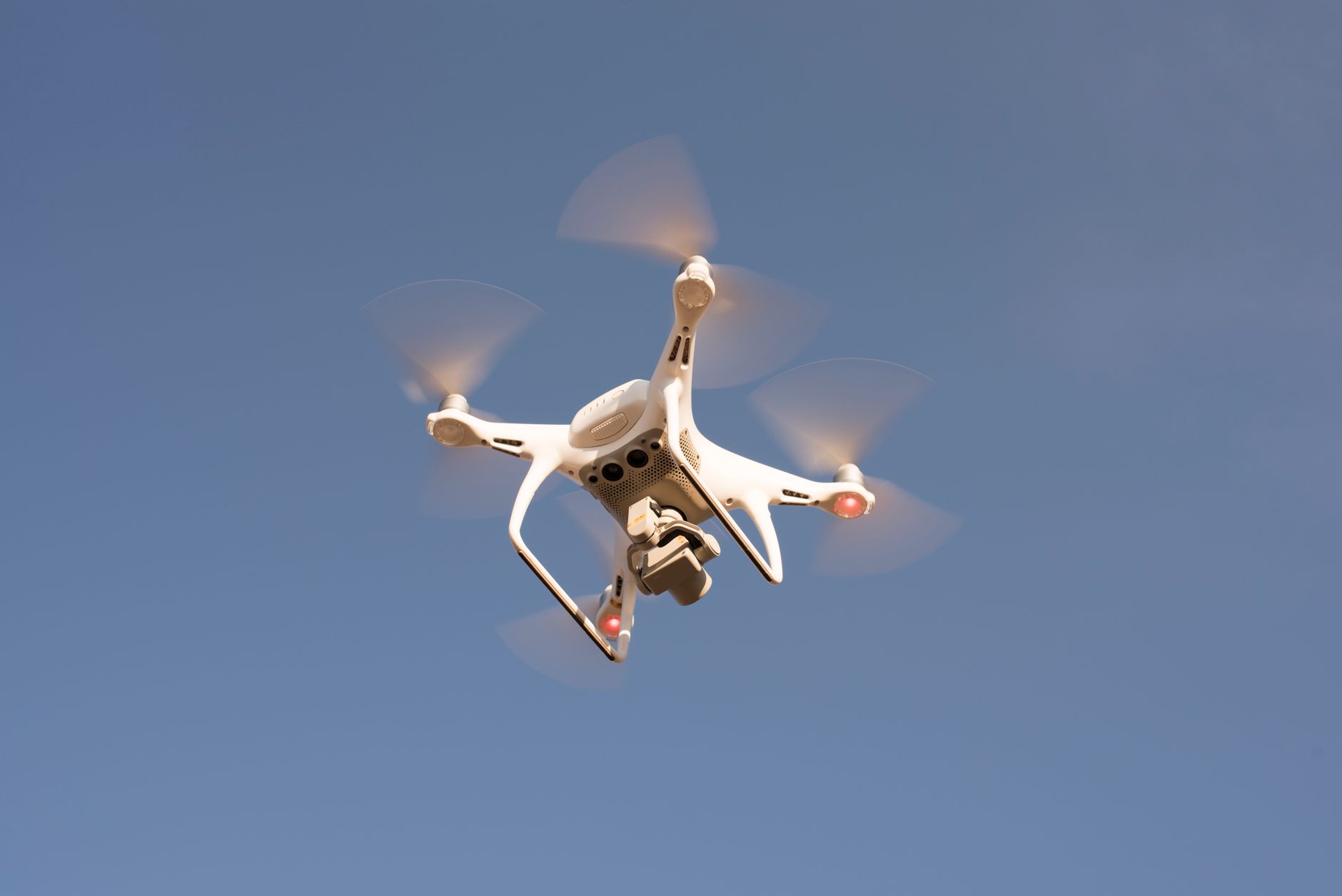 Small delivery drone flying outdoors as part of a retail logistics test program