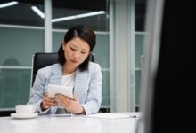 Modern corporate office with employees working on computers representing enterprise AI adoption
