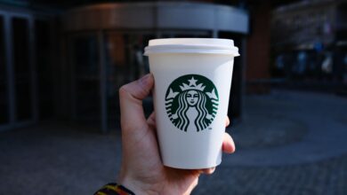 Starbucks barista preparing drinks at a busy coffee counter