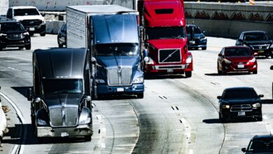 Semi-truck driving on a highway representing the digital freight brokerage market