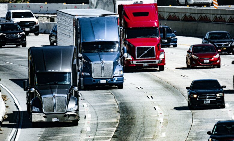 Semi-truck driving on a highway representing the digital freight brokerage market
