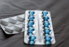 Close-up of prescription medication bottles representing pharmaceutical patent disputes