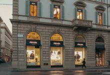 Elegant luxury fashion boutique interior with display cases and soft lighting