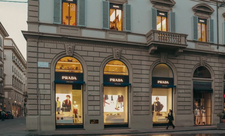 Elegant luxury fashion boutique interior with display cases and soft lighting