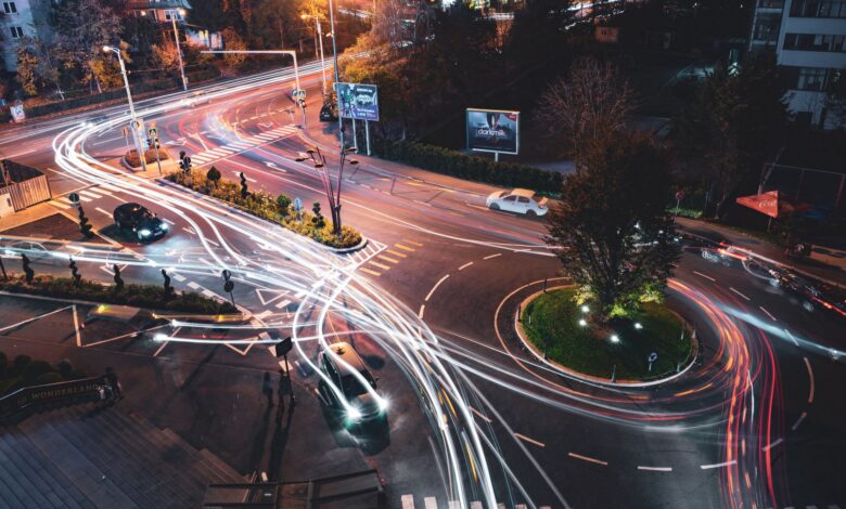A self-driving vehicle navigating an urban road, representing the robotaxi industry