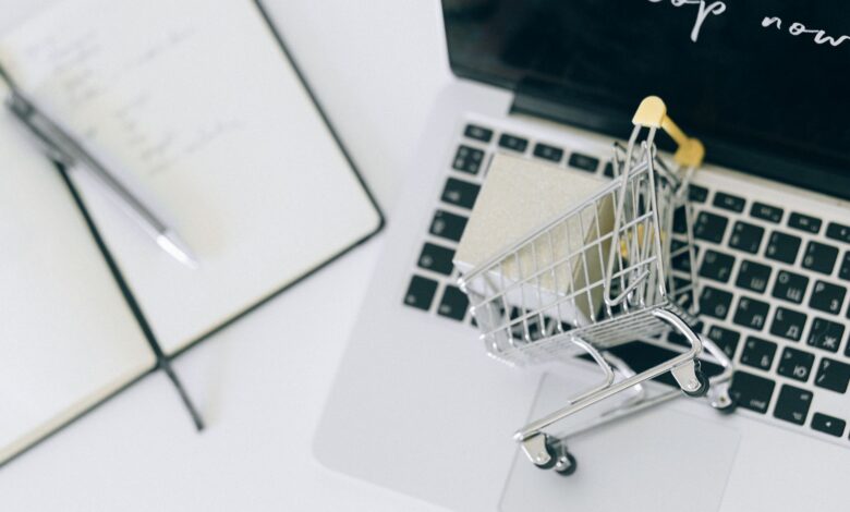 Person browsing an online shopping platform on a laptop, representing digital retail advertising