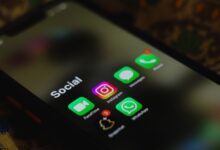 Person scrolling through a social media app on a smartphone