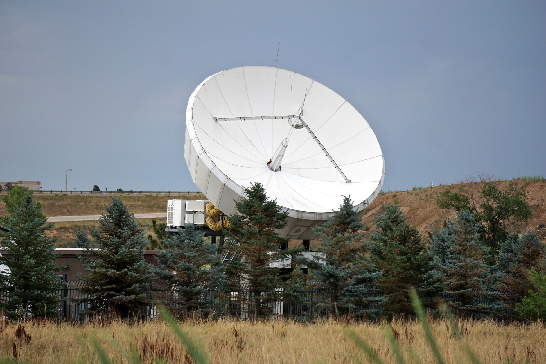 A satellite dish installed at a remote rural property representing internet connectivity in underserved areas
