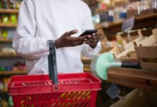 Person browsing a shopping app on a smartphone representing social commerce growth