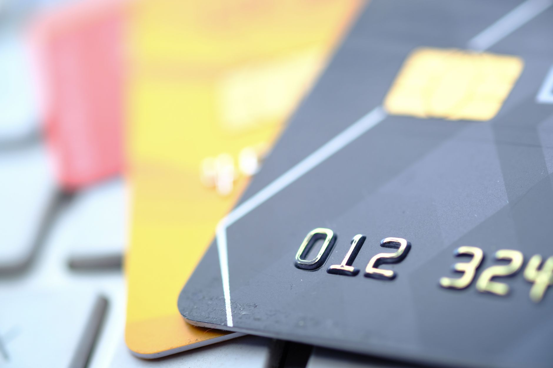 Close-up of a credit card representing the Apple Card partnership costs absorbed by Goldman Sachs