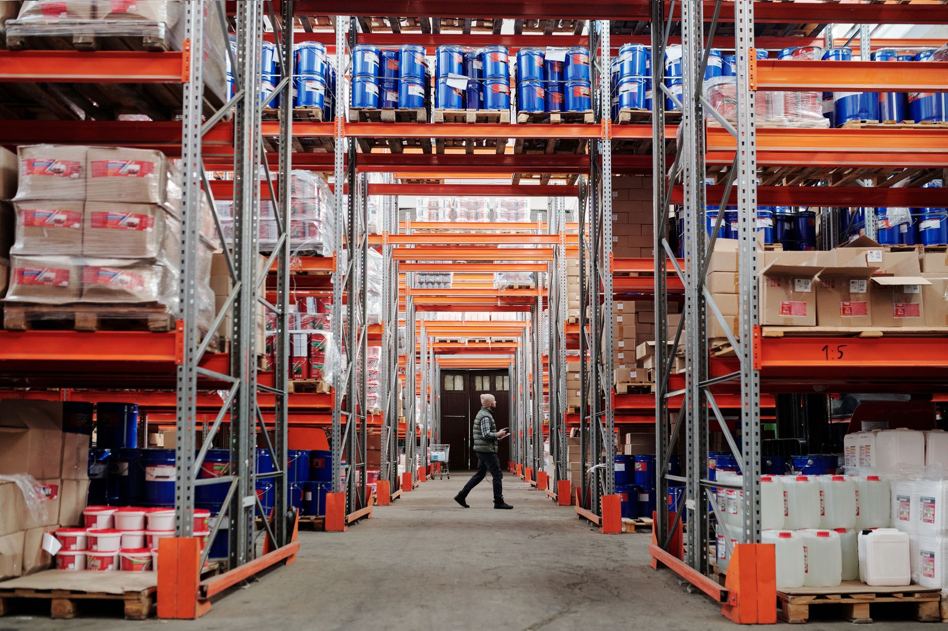 Workers inside a logistics warehouse sorting freight shipments