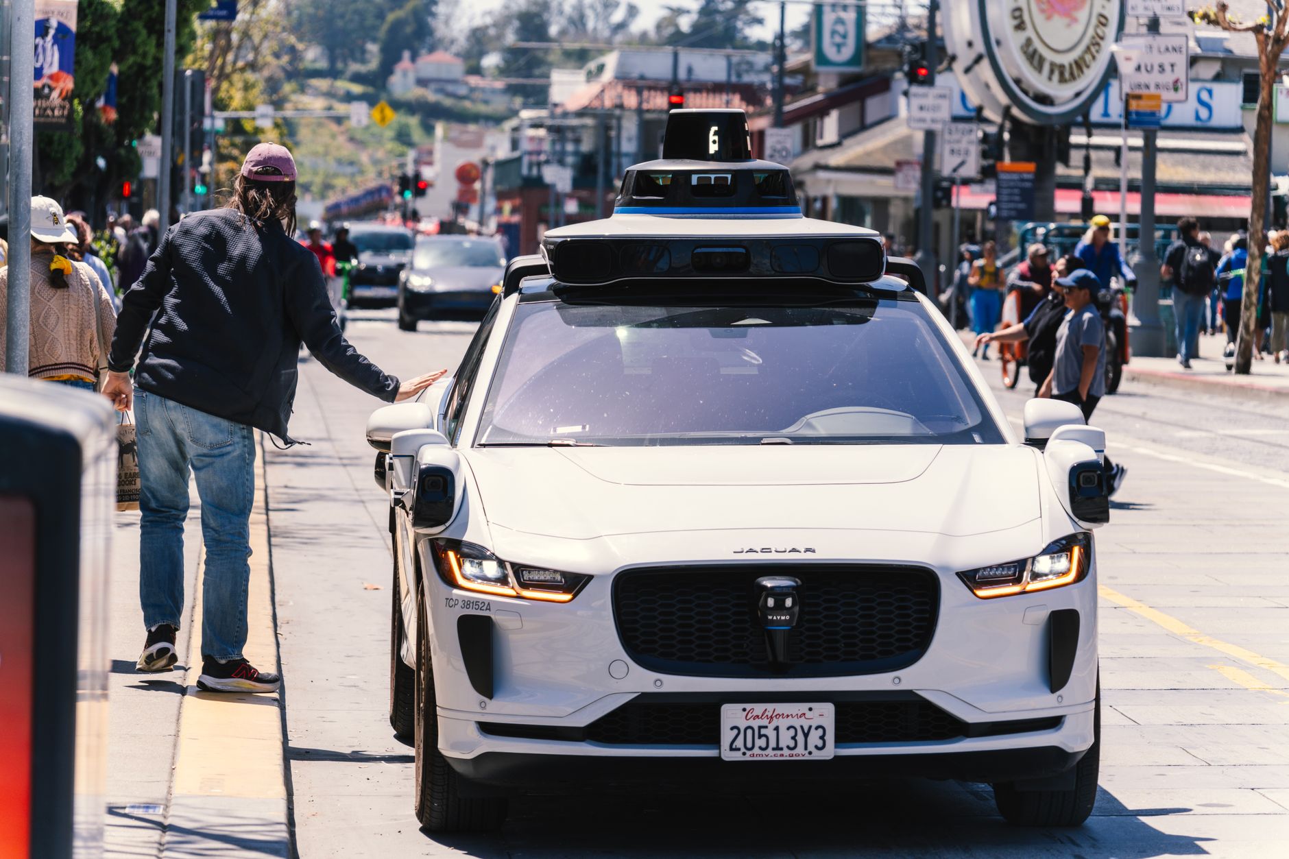 Self-driving vehicle on an urban road representing robotaxi technology