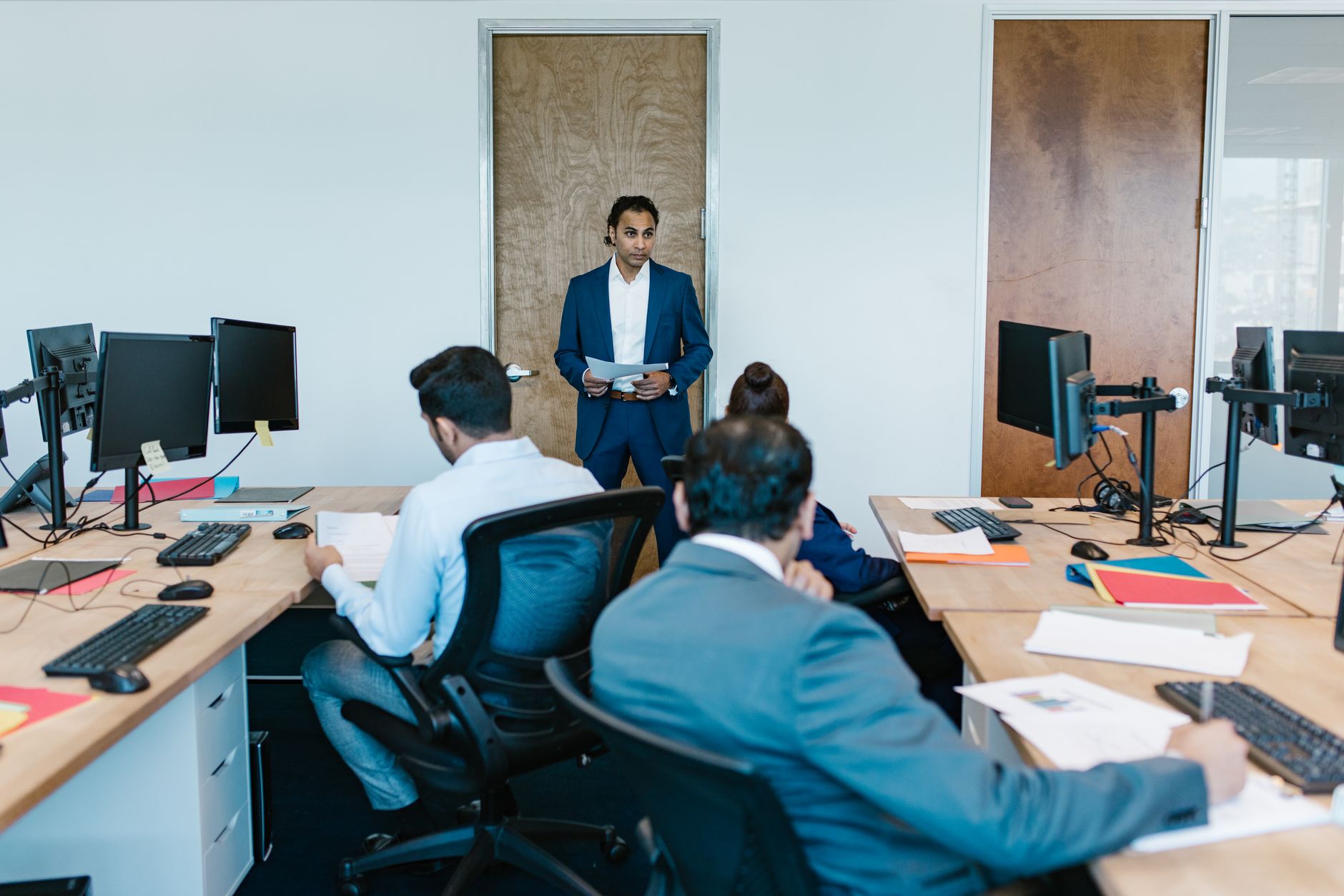 Business professionals in a meeting room, representing enterprise-level strategy discussions
