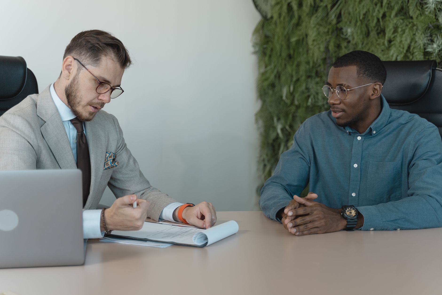 A recruiter conducting a professional interview, representing the human judgment AI tools aim to replicate