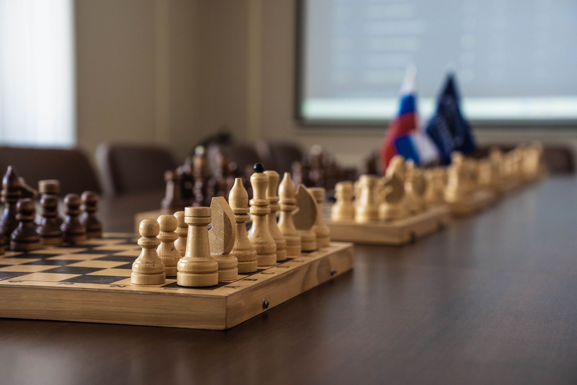 Business professionals reviewing competitive strategy documents in a corporate setting