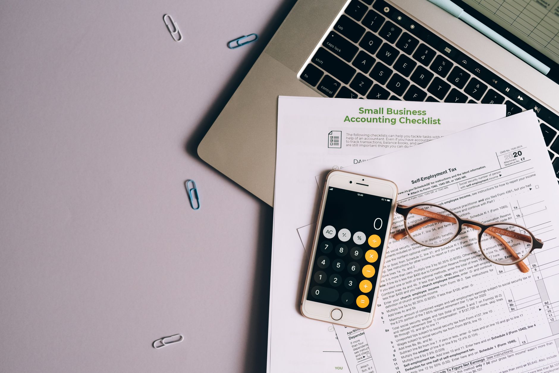 Finance professional reviewing documents at a corporate banking desk