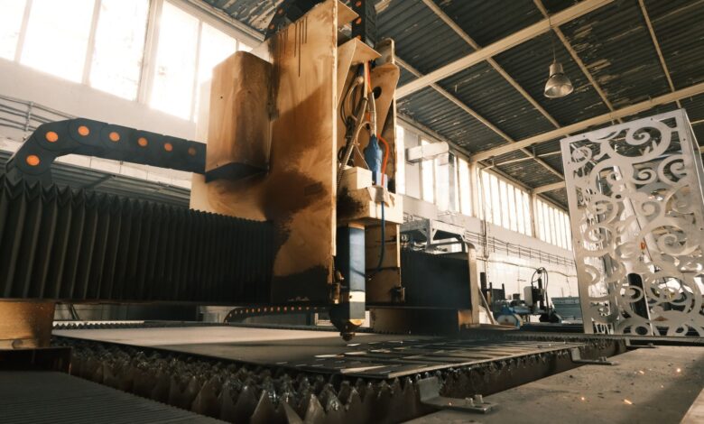 Workers on an aerospace manufacturing floor assembling large aircraft components