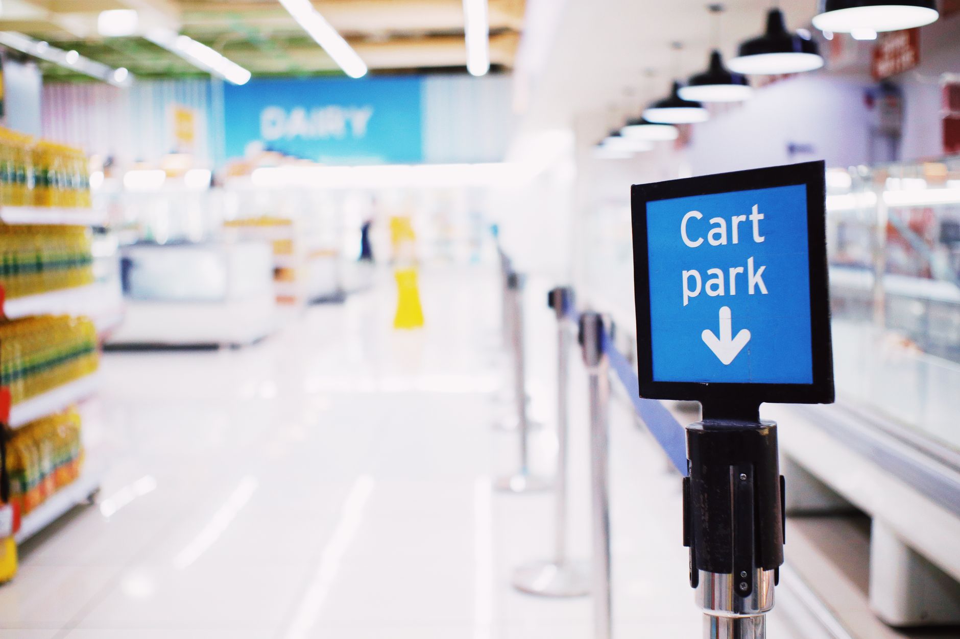Wide retail store aisle with product shelves representing Walmart's physical store advertising advantage