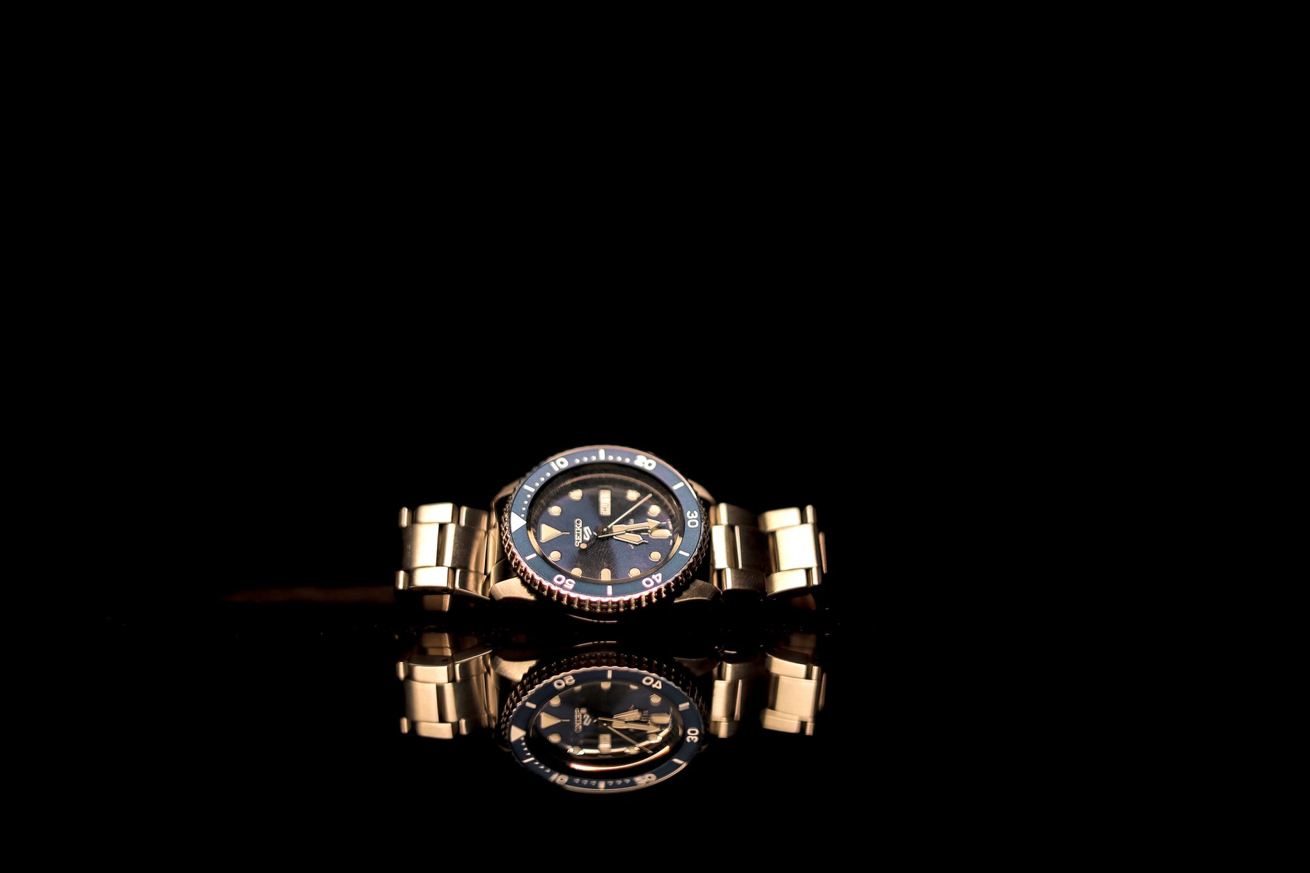 Close-up of a luxury mechanical watch face showing intricate dial detailing