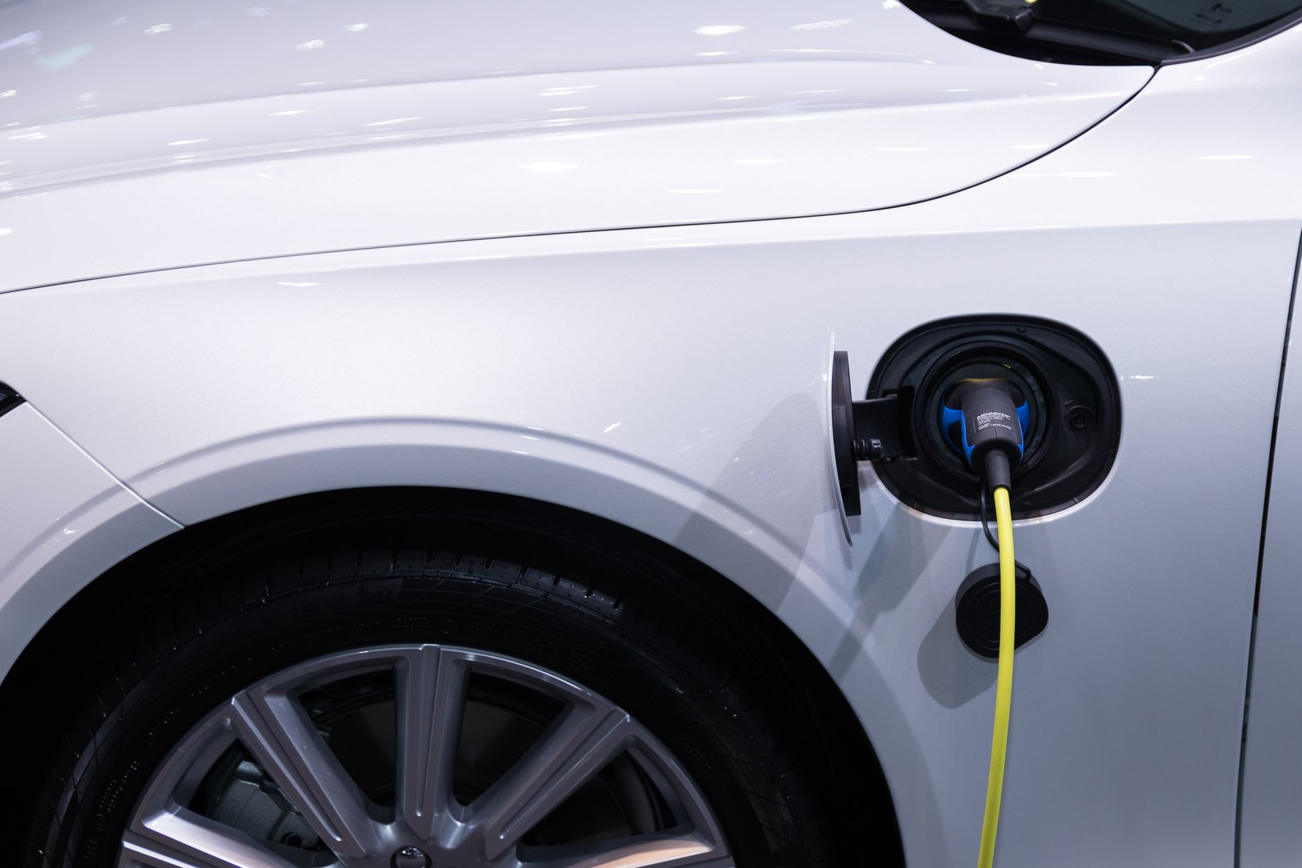 A hybrid vehicle driving on an open highway representing fuel-efficient automotive technology