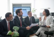 Financial advisors working in a modern wealth management office environment