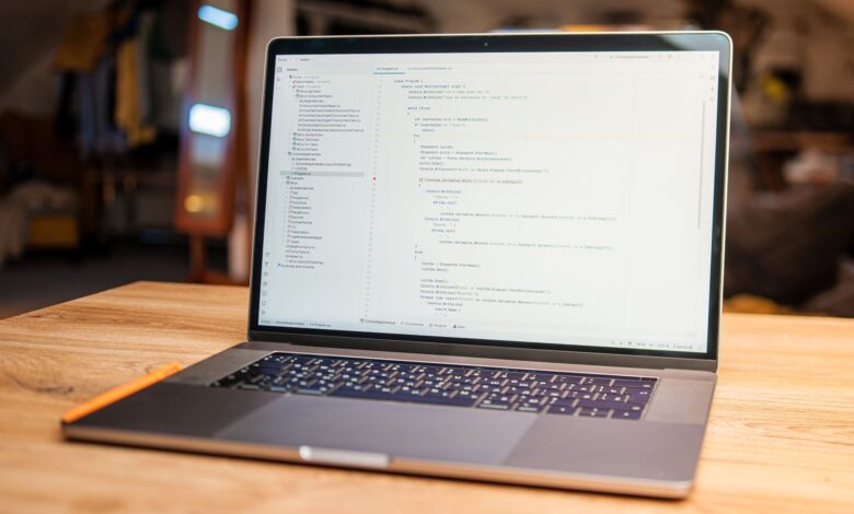A laptop displaying a productivity software interface in a modern office setting
