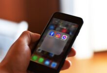 Person scrolling through a social media feed on a smartphone