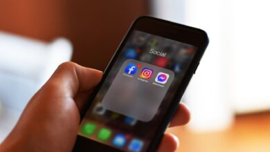 Person scrolling through a social media feed on a smartphone
