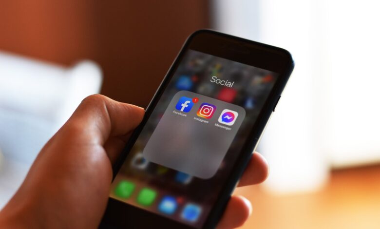 Person scrolling through a social media feed on a smartphone