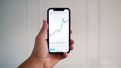 Person using a mobile trading app on a smartphone