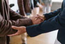 Business professionals in a formal meeting discussing investment portfolio strategy