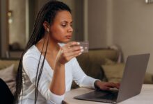Person completing an online purchase at checkout using a buy now pay later option