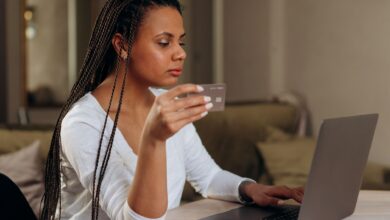 Person completing an online purchase at checkout using a buy now pay later option
