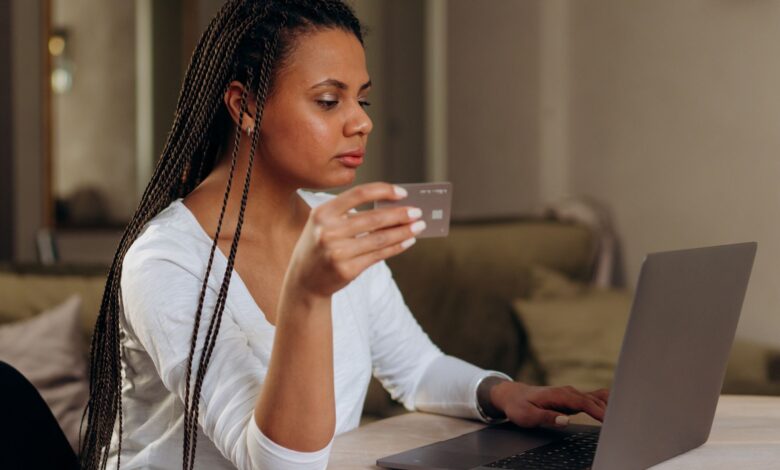 Person completing an online purchase at checkout using a buy now pay later option