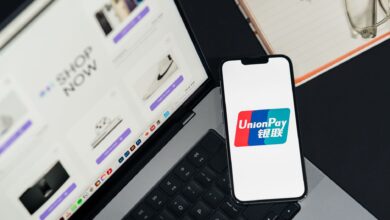 Close-up of a smartphone displaying a digital payment interface at checkout