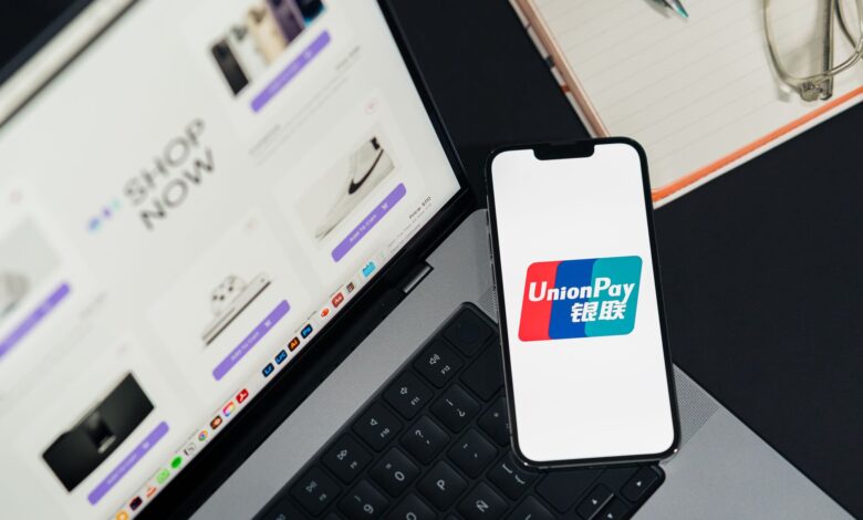 Close-up of a smartphone displaying a digital payment interface at checkout
