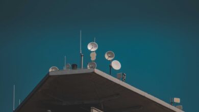 A satellite dish installed in a rural area representing remote internet connectivity options