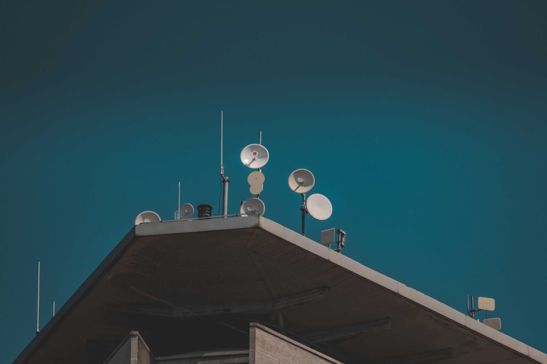 A satellite dish installed in a rural area representing remote internet connectivity options