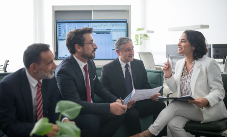 Financial advisors working in a modern wealth management office environment