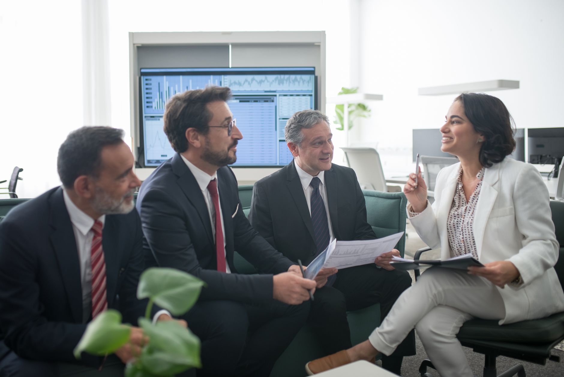 Financial advisors working in a modern wealth management office environment