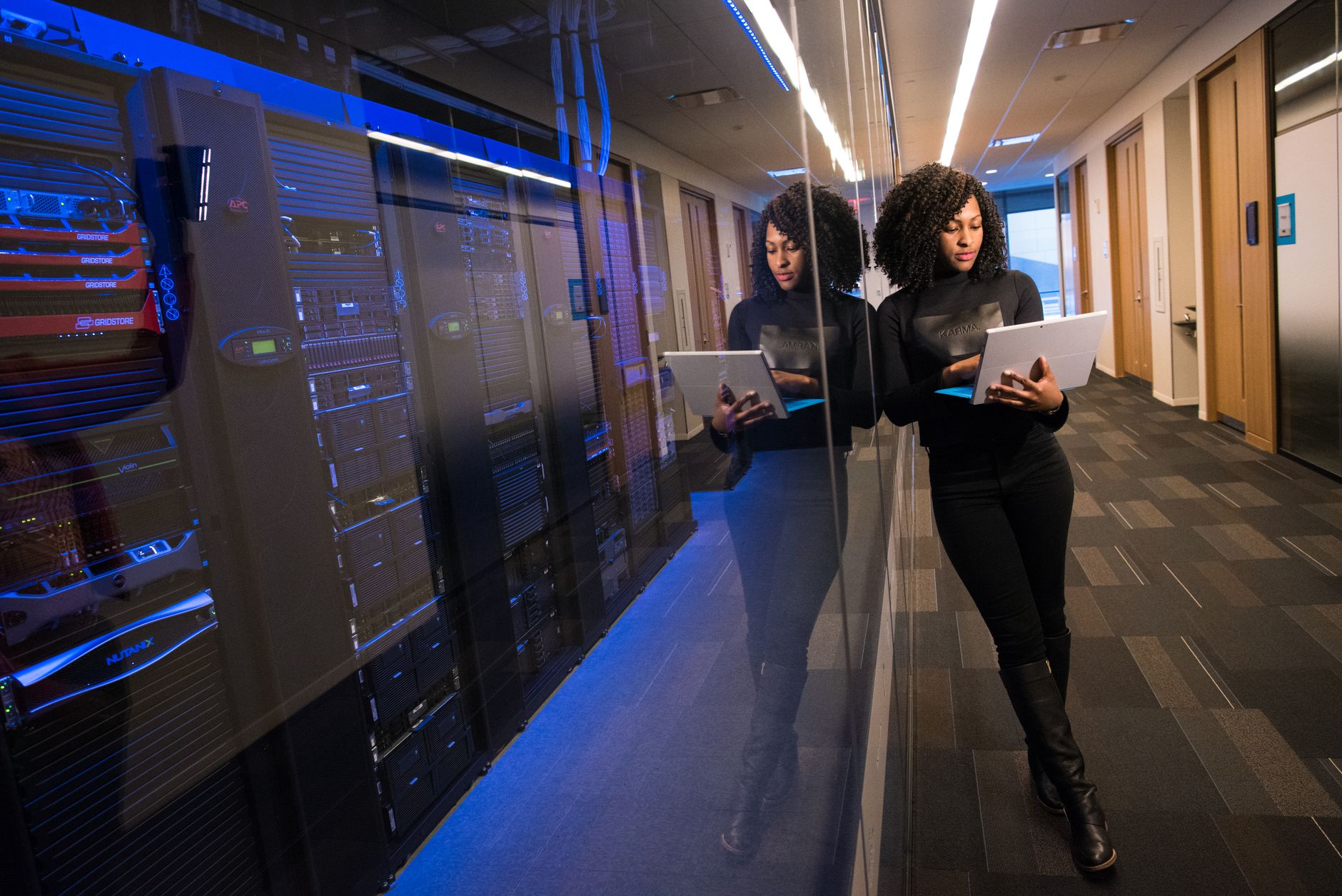 Rows of servers inside a large data center representing hyperscaler infrastructure