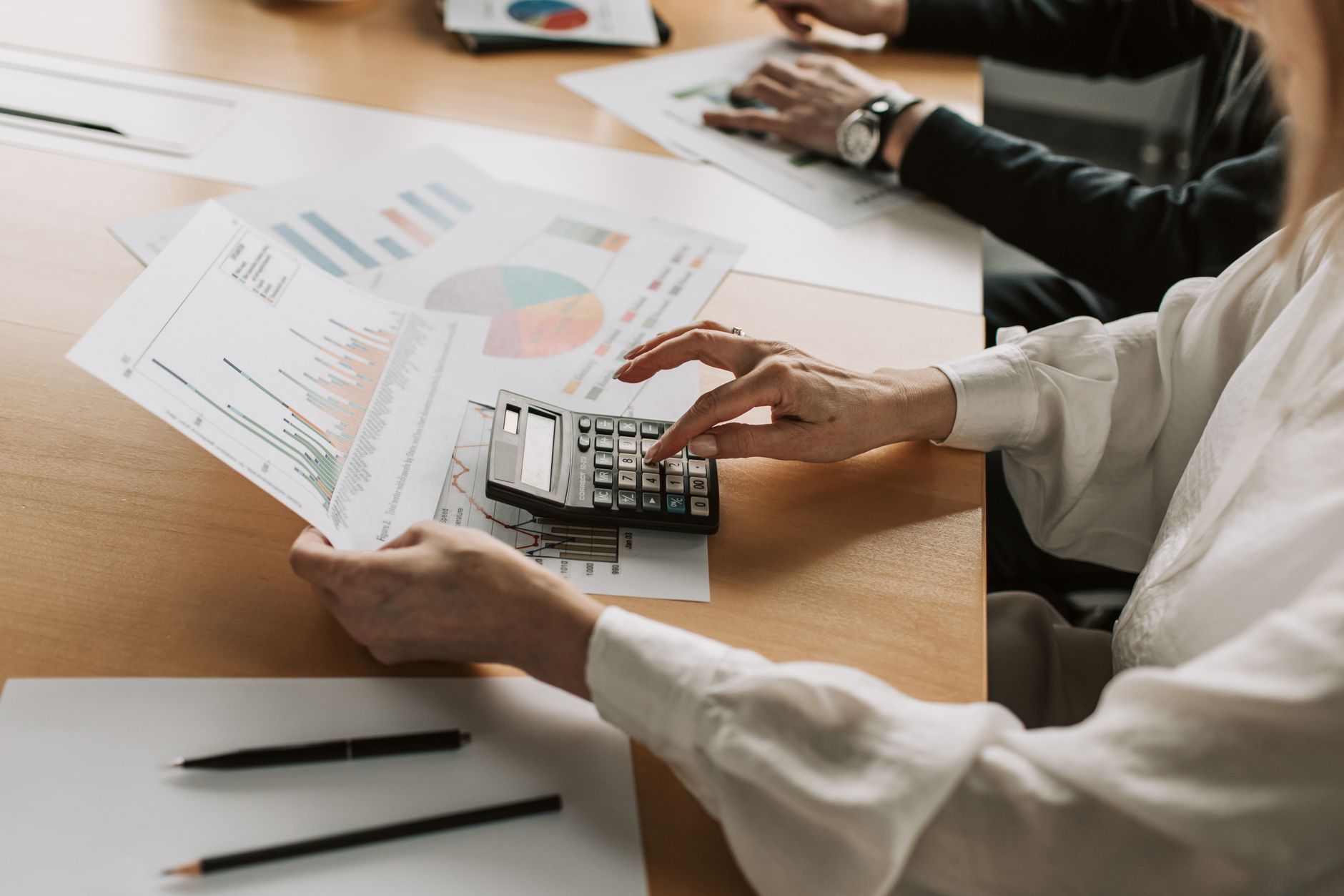 Business professionals in a financial strategy meeting inside a corporate office