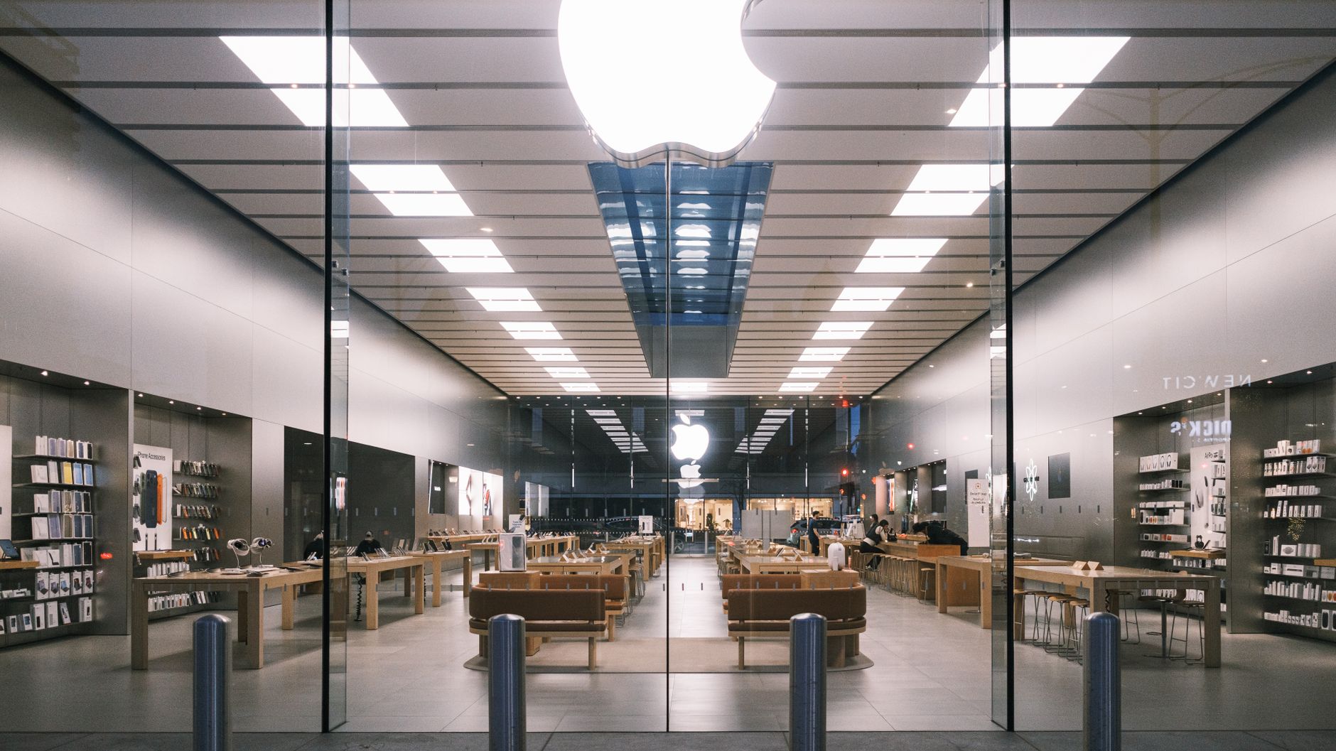 Interior of a technology retail store with devices on display counters