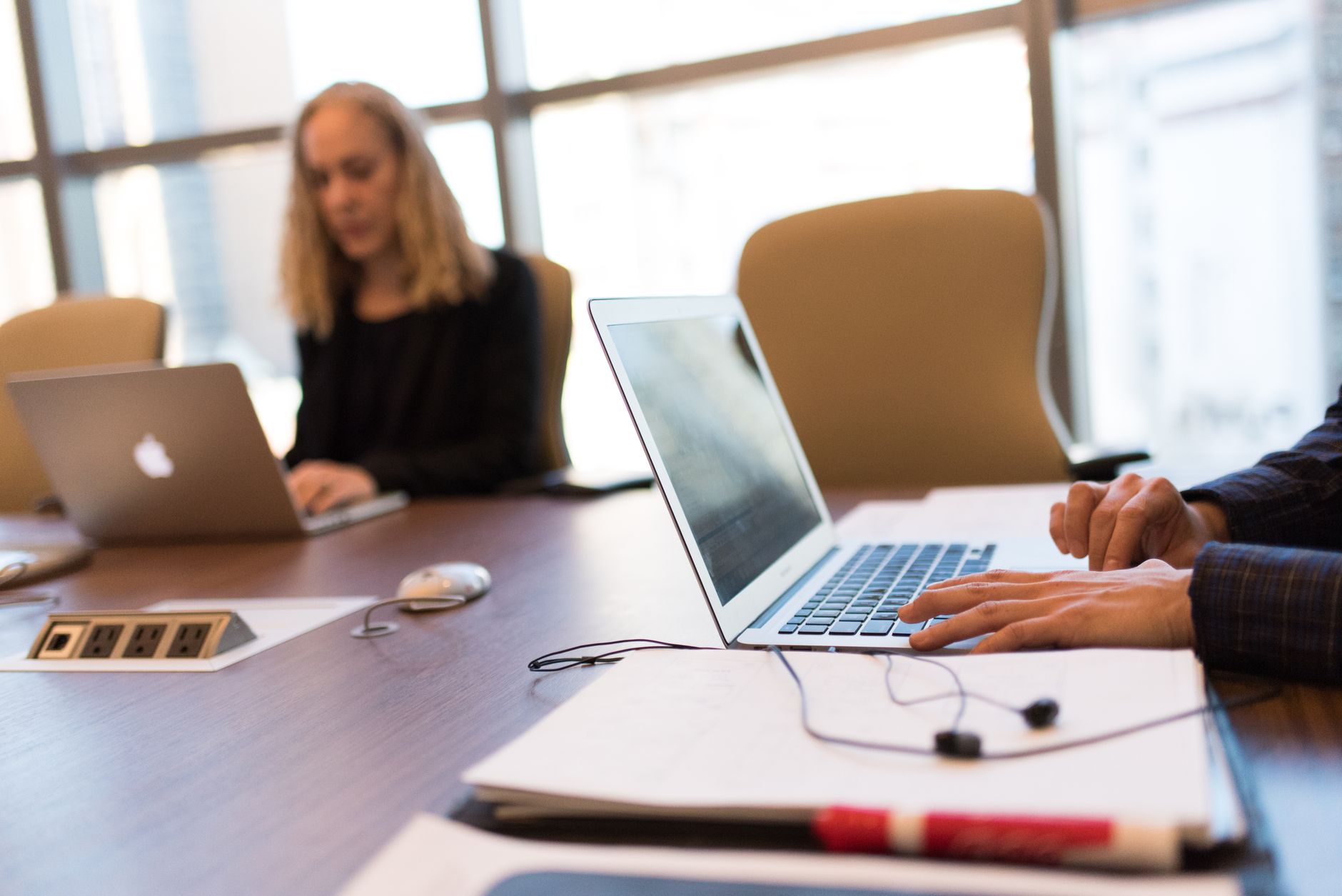 Business professionals reviewing data and strategy in a modern office environment