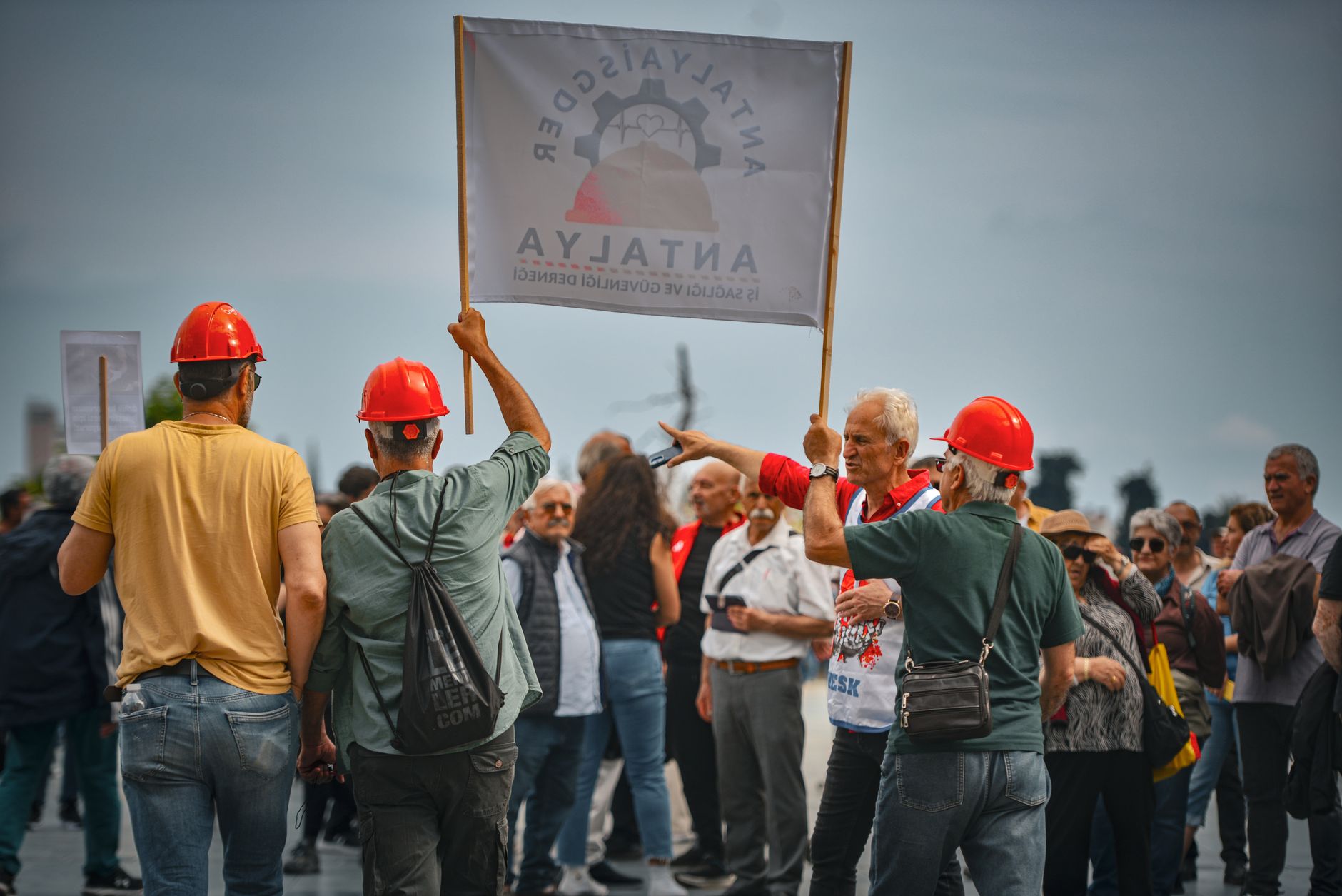 Workers holding signs at a labor organizing demonstration