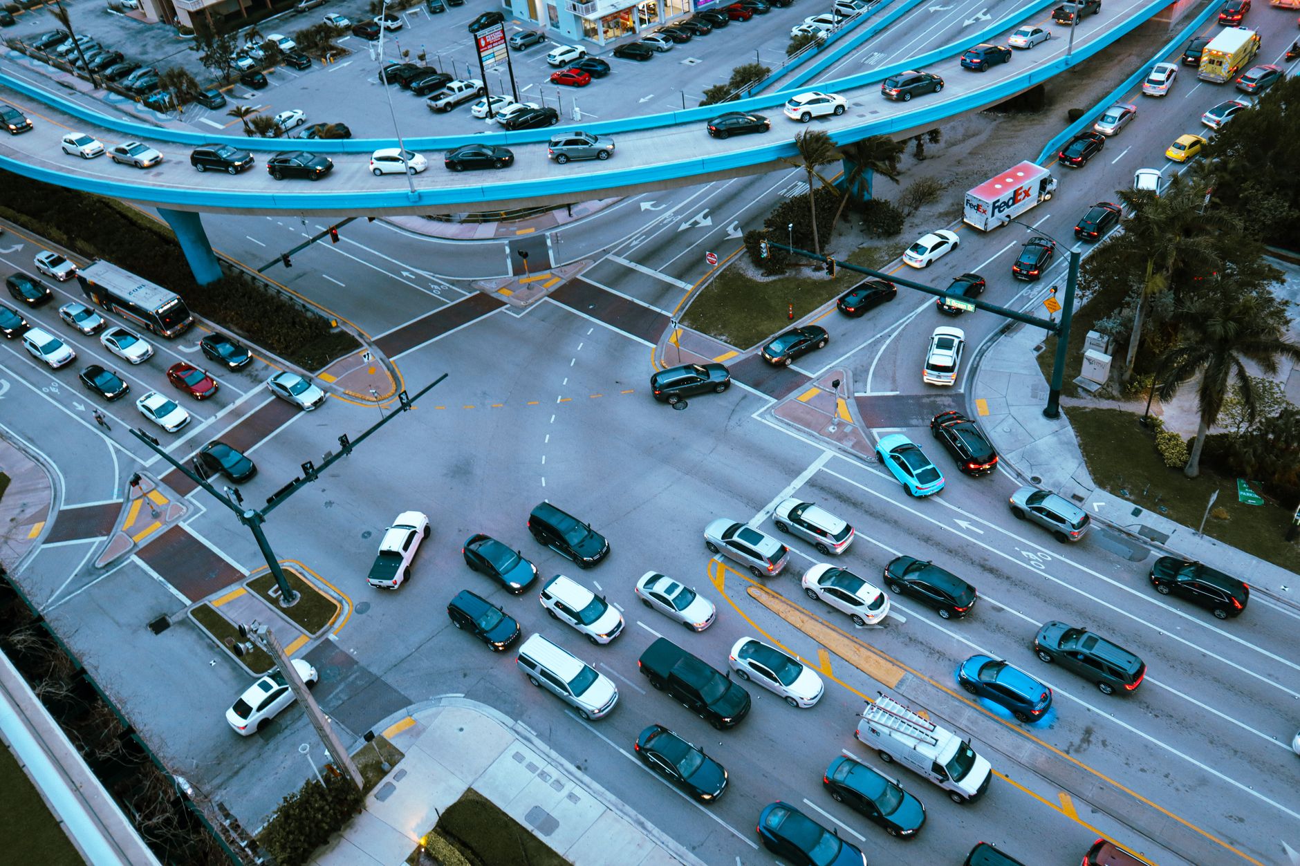 Aerial view of city traffic illustrating the urban markets where Waymo and Uber compete