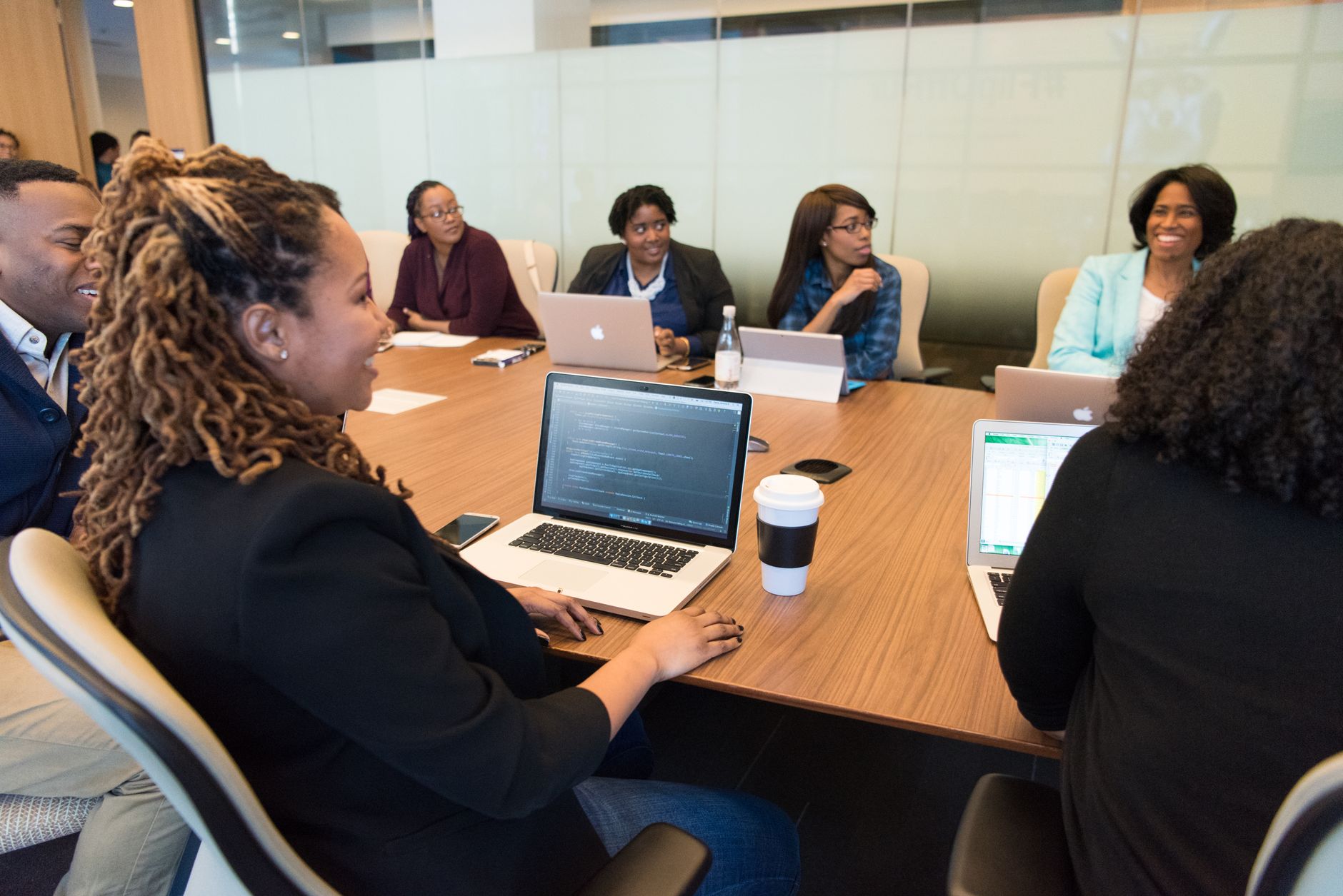 Business professionals in a technology company meeting discussing procurement strategy
