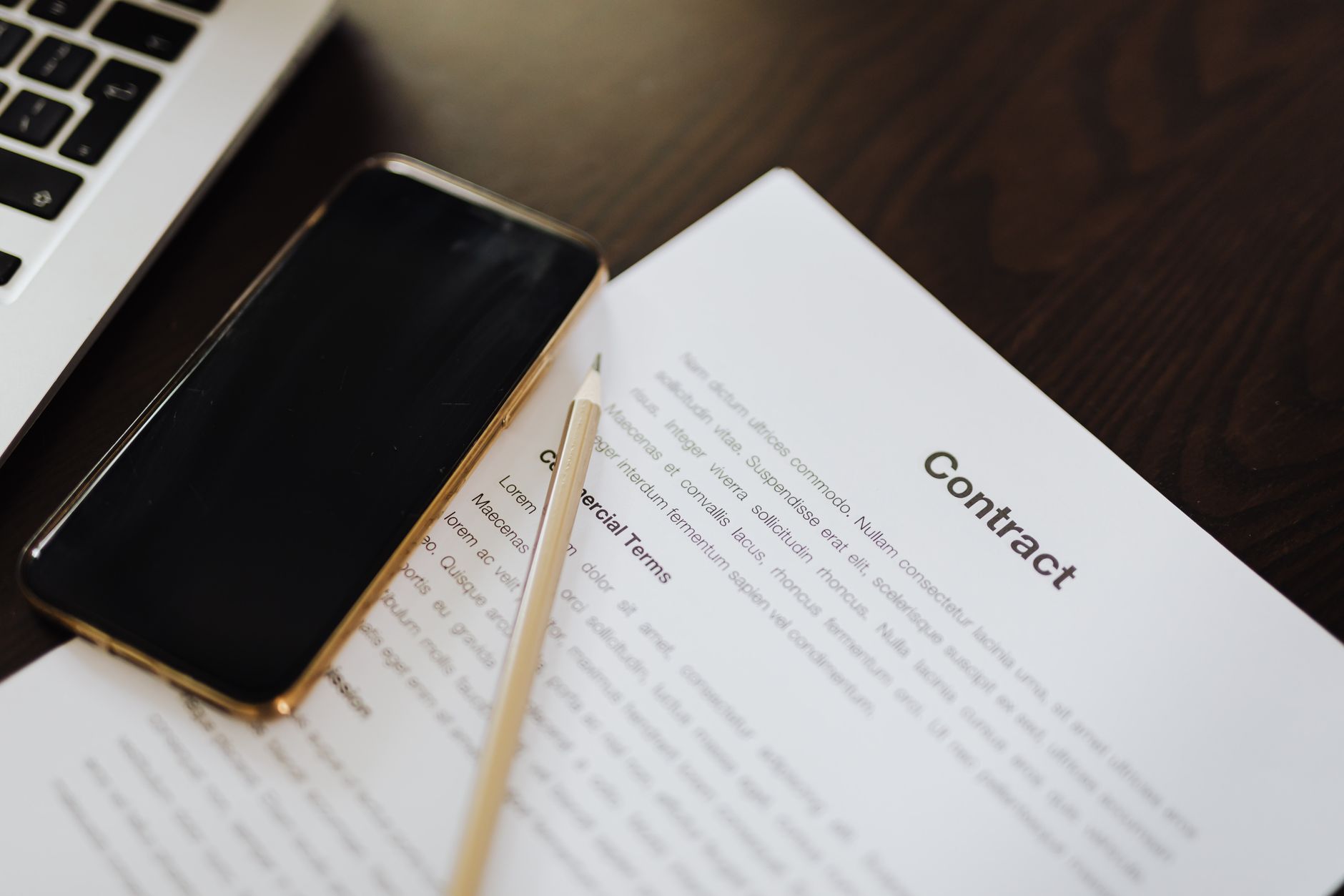 Business professionals reviewing and signing enterprise software or contract documents