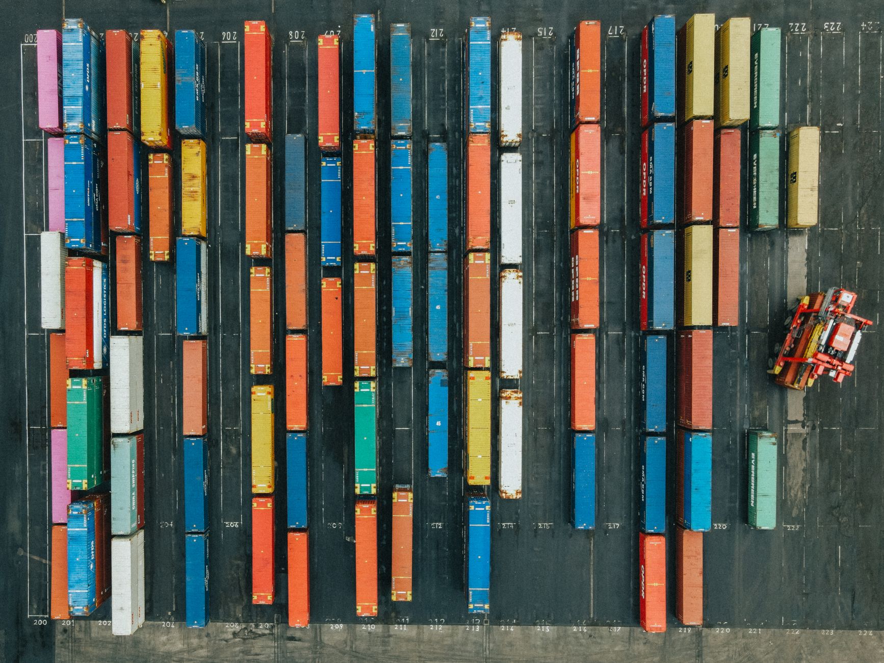 Aerial view of a large fulfillment warehouse representing Amazon's retail infrastructure